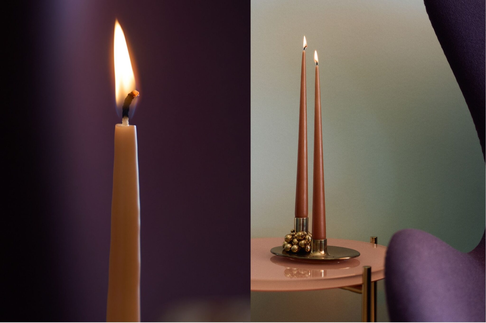 Nærbillede af en rolig flamme på en bomuldsvæge og to støvet rosa hånddyppede stagelys i messingstage på et lyserødt sidebord